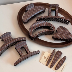 Elegant cocoa brown hair claw clips with white diagonal stripes for thick hair styling