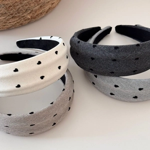 Padded heart pattern headbands in white and grey colors with fabric flocking texture