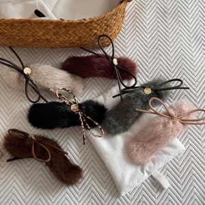Set of six plush bow hair clips in assorted colors including beige, burgundy, and deep green