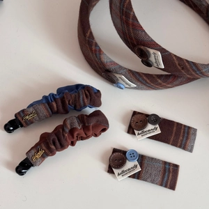Detailed set of brown plaid fabric hair accessories with retro buttons and handmade tags