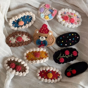 Cute crochet wool hair clips set featuring animal and floral shapes for children