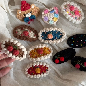 Cute handmade crochet hair clips featuring cartoon bear and floral wool patterns