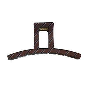 Brown printed large hair claw clip with twill pattern for thick hair in a sleek design
