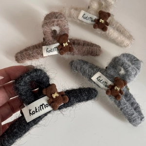 Fuzzy bear hair claw clips in beige brown and grey colors for thick hair styling