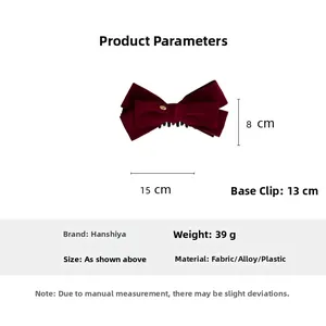 Detail of burgundy velvet bow hair clip showing dimensions of 15cm width and 13cm base length