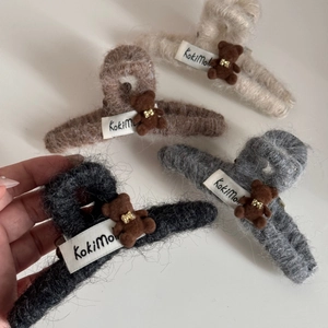 Close-up of fuzzy bear hair claws with plush texture and cute 3D bear detail in winter style