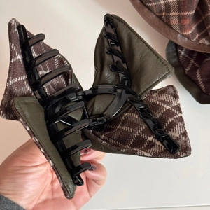 Chic bow hair claw clip with dark green faux leather and classic brown plaid fabric inlay