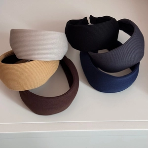 Detailed texture of thick knitted padded headbands in various colors for women