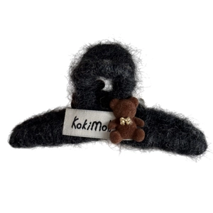 Cute brown flocked bear hair claw clip with black faux fur texture and a gold bow