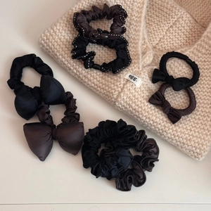 7-piece set of brown and black bow hair scrunchies with satin and pleated textures