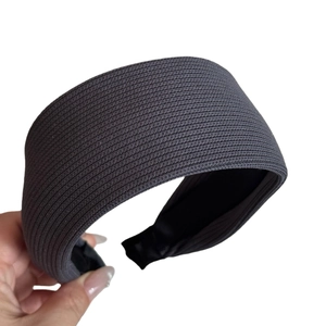 Dark grey knitted wide headband with ribbed texture for a stylish minimalist look