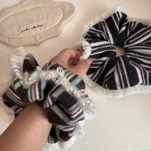 Striped knit scrunchies with white plush trim in black, blue, and pink for women