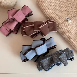 Retro multi-layer suede bow banana hair clips in pink, brown, blue, and gray colors