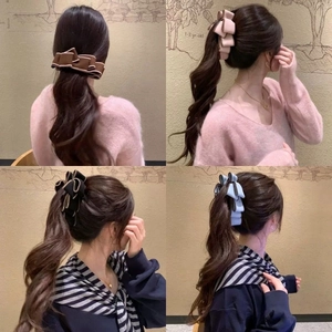 Detail of multi-layered suede bow hair clips in four elegant colors with contrast piping