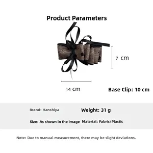 Detailed view of layered brown polka dot ribbon hair clip with 10cm metal fastener