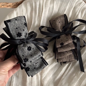 Set of two French tweed bow hair clips in black and brown with satin ribbon details