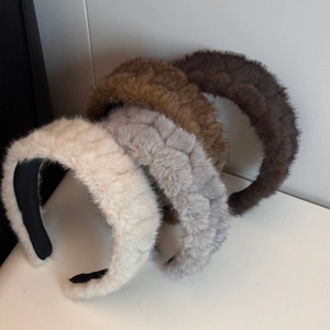 Thick plush braided headbands in beige, grey, and brown with soft faux fur texture