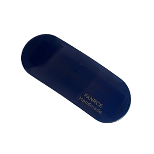 Minimalist oval acetate hair clip in dark blue with gold handmade lettering detail