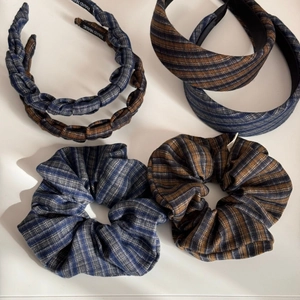 Flat lay of French striped fabric headbands and matching scrunchies set with Hand Made label
