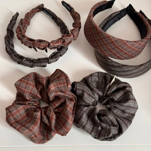 Close-up of retro plaid fabric headband set including hair ties in brown and grey tones