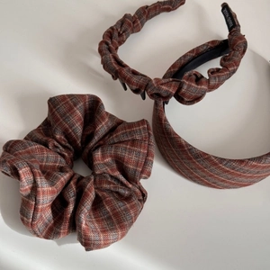 Three-piece retro plaid fabric headband set in brownish red featuring woven twist and scrunchie