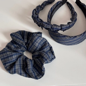 Close-up of blue grey striped fabric headband set featuring hand made texture and details