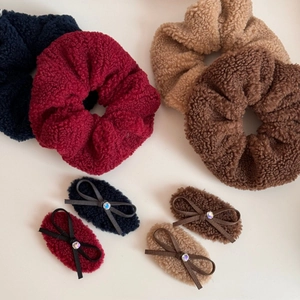 8-piece set of plush velvet hair scrunchies and bow clips in assorted warm winter colors