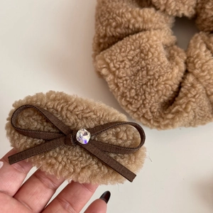 Detailed view of plush camel faux fur bow hair clip and matching oversized scrunchie set