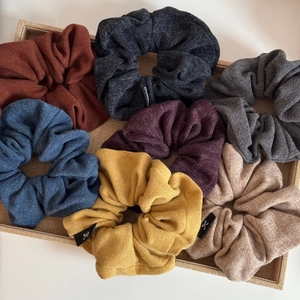 Set of 7 colorful knitted scrunchies for hair buns with soft textures and elastic design