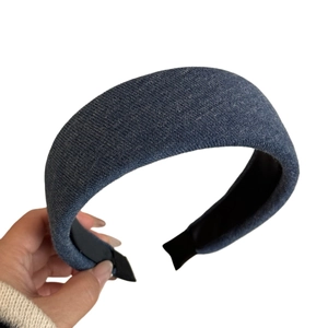 Navy blue knitted padded headband with high top design and non-slip lining