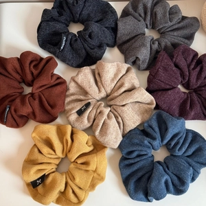 Set of 7 large knit scrunchies in various solid colors for ponytail styling