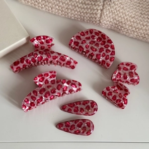 Detail of pink leopard print hair claw set including various sizes and clip styles