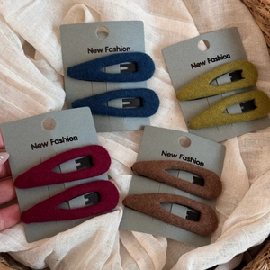 Set of four pairs of plush teardrop BB clips in deep blue, olive, burgundy and brown