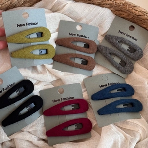 Detailed view of plush water-drop BB hair clips in six colors on premium card packaging