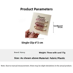 Detailed view of three checkered hair clips on a card showing 6x2cm dimensions