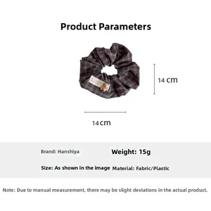 Detailed view of dark blue plaid scrunchie with cute bear charm and size specifications