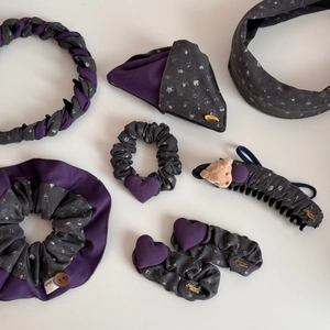Detailed view of handmade floral scrunchies, headbands and bear claw clips set