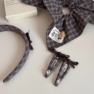 Detail view of plaid bear scrunchie set with headband and crystal hair clips