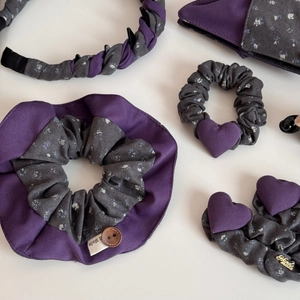 Detail view of purple floral fabric scrunchies and headband with handmade buttons