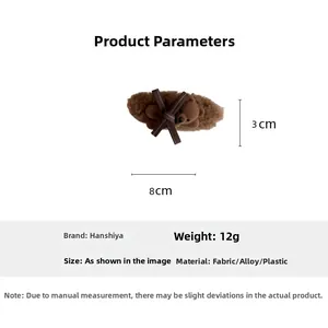 Brown plush bear hair clip with bow showing detailed dimensions of 8cm by 3cm