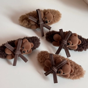 Set of 4 plush bear hair clips with bow details in brown and tan tones for women