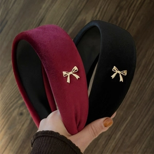 Padded velvet headband in wine red and black with elegant golden bow charms for women
