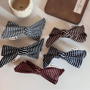 Five-piece set of striped fabric bow hair clips in black, navy, and burgundy colors