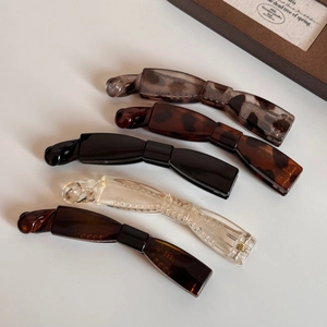 Set de cinq barrettes bananes en résine ambrée et couleurs unies pour queues de cheval