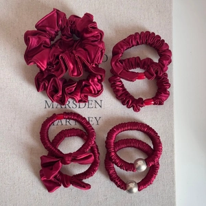 Festive wine red satin scrunchies set including ribbon bows and beaded hair ties
