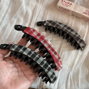 Three-piece acetate banana clip set with classic red and black plaid patterns for women