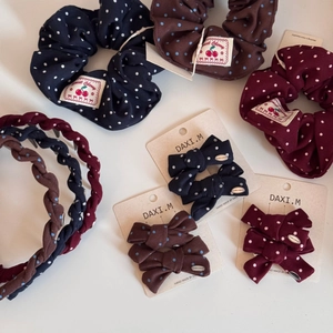 Retro polka dot hair accessory set including scrunchies, bow clips, and headbands