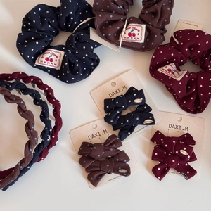 Polka dot hair accessory set with scrunchies and bow clips in classic retro colors