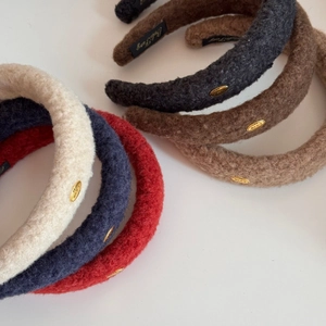 Thick plush winter headbands with golden LOVE metal logo in various elegant colors