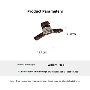 Pince à cheveux en tweed marron avec nœud, dimensions de 13,5 cm par 5,5 cm